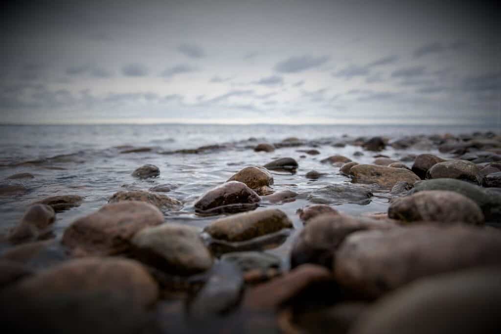 Rocky shoreline looking out into the ocean on an overcast day