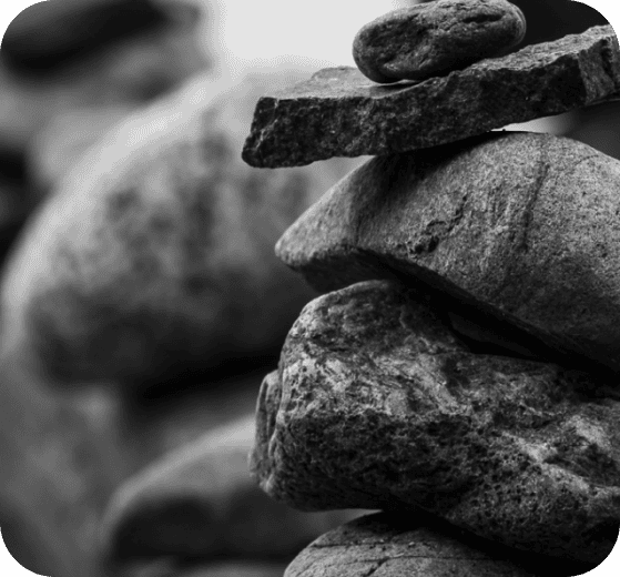 Black and white rocks balanced on top of eachother