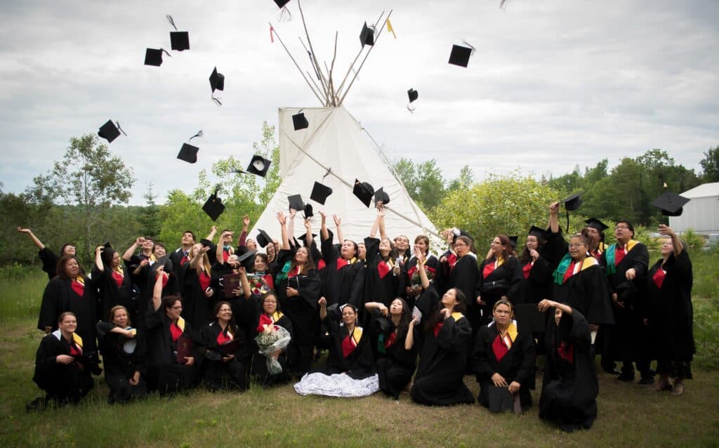 Grads throwing their caps into the air